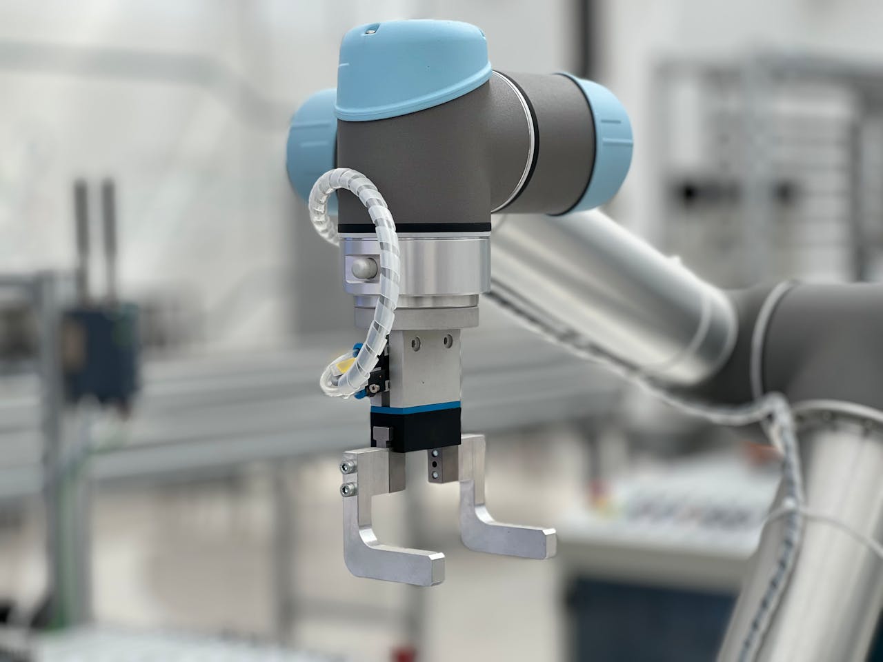 Close-up of a robotic arm in a modern industrial environment, highlighting technology.