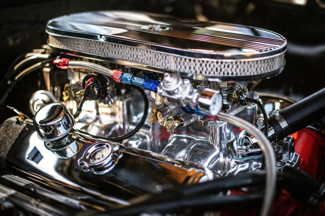 Detailed view of a shiny chrome car engine highlighting automotive technology.